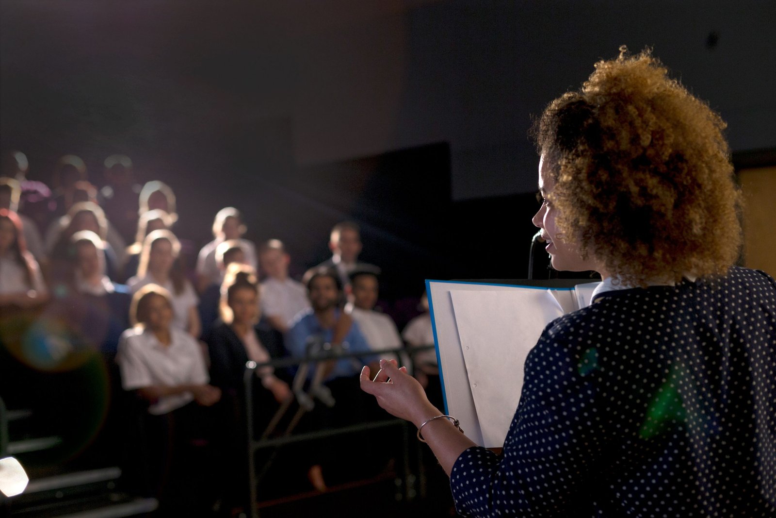 Woman speaking in crowd