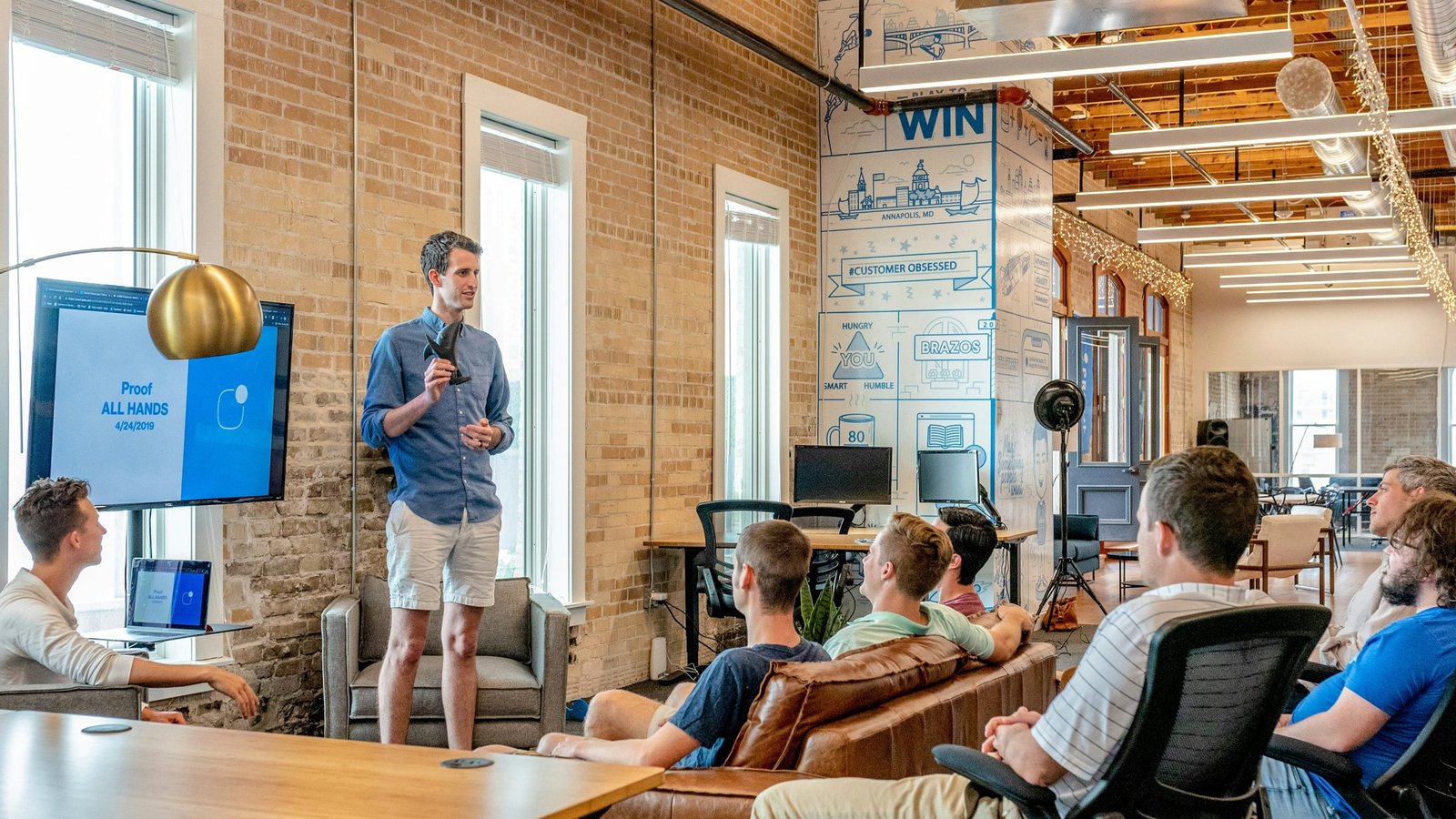 man mastering the art of speaking in the workplace and communicating to colleagues